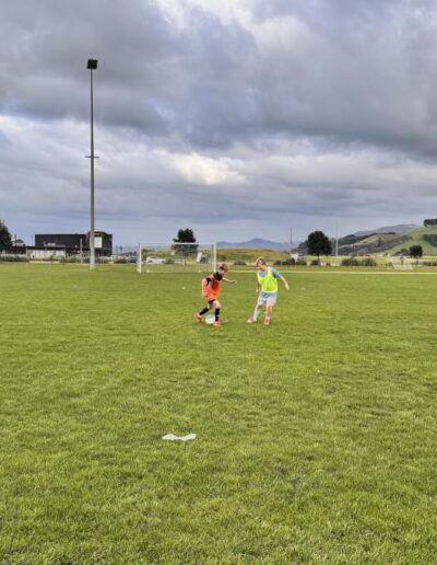 Youth soccer players practicing one-on-one drills at PureFootball Papamoa