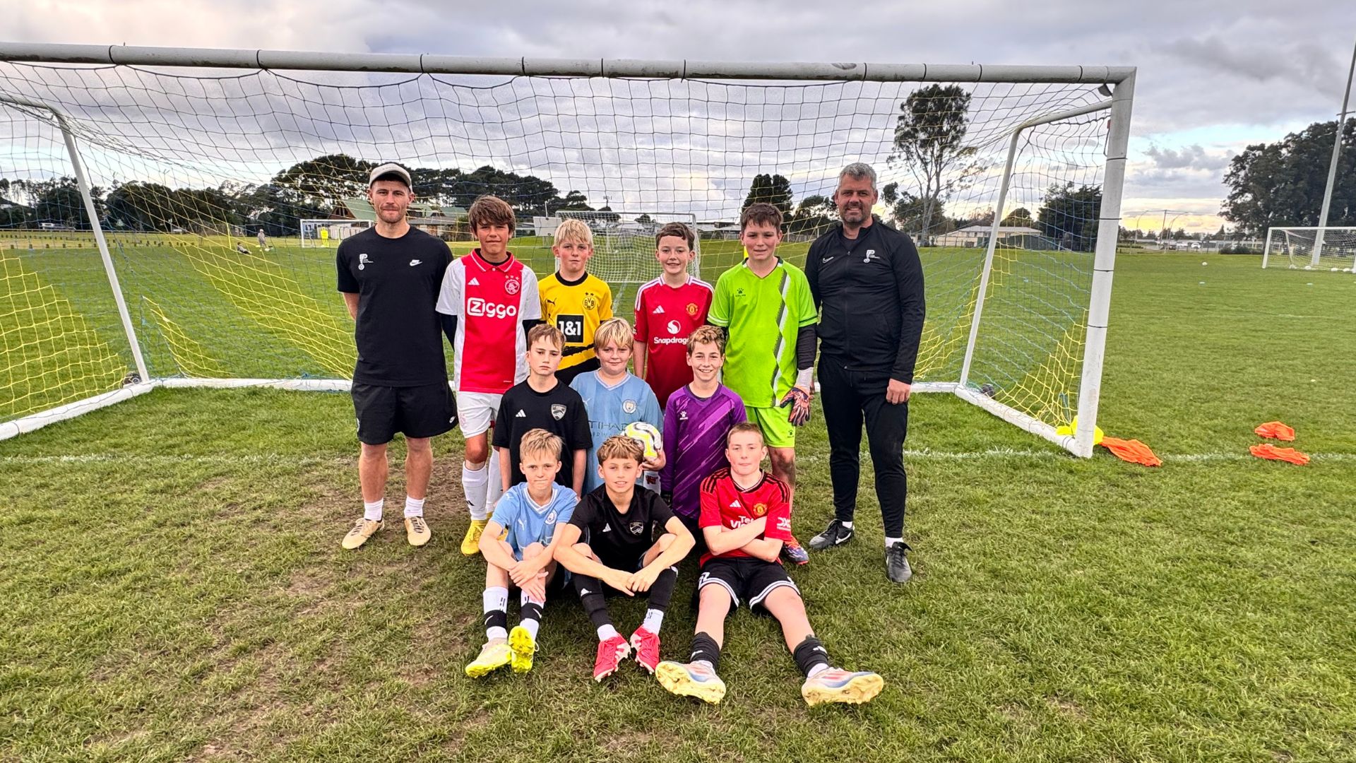 Team football training drills at PureFootball Papamoa